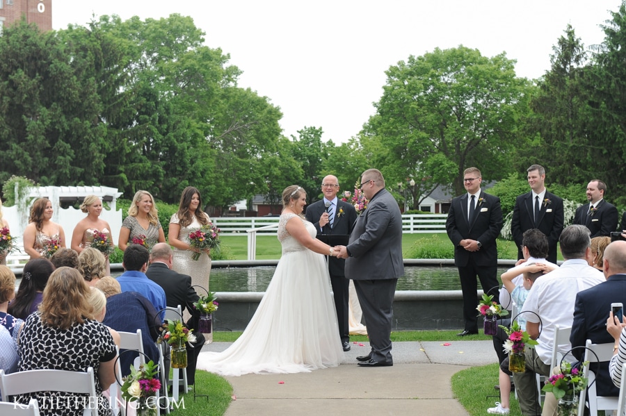 Wedding Vows in front of fountain at Earle Brown Heritage Center