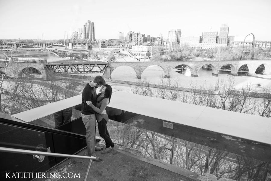 Engagement photo at the Guthrie Theater with view of Stone Arch Bridge